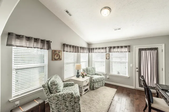 a bedroom with a bed and dresser