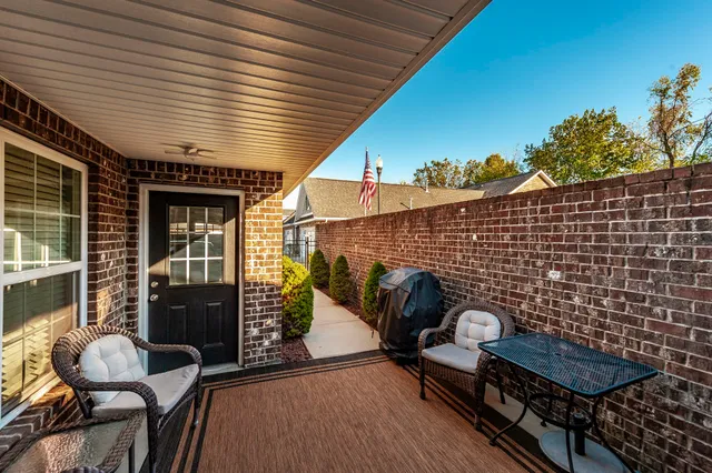 a large kitchen with a table and chairs