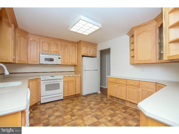 115 Brookside Road Newtown Square, PA 19073 - Photo 14 of 24 a kitchen with stainless steel appliances granite countertop a refrigerator sink and stove