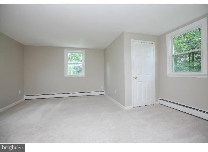 115 Brookside Road Newtown Square, PA 19073 - Photo 22 of 24 a view of an empty room with a window
