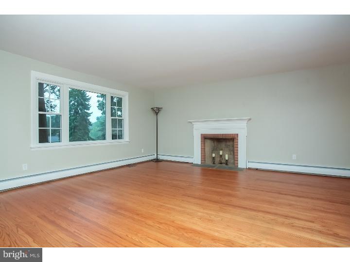 115 Brookside Road Newtown Square, PA 19073 - Photo 4 of 24 a view of an empty room with wooden floor and a window