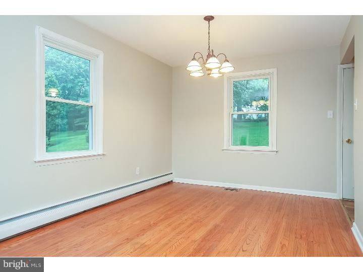 115 Brookside Road Newtown Square, PA 19073 - Photo 5 of 24 an empty room with wooden floor and windows