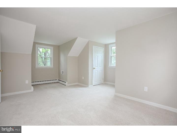 115 Brookside Road Newtown Square, PA 19073 - Photo 9 of 24 an empty room with windows and closet