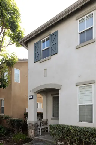 a front view of a house with sitting area