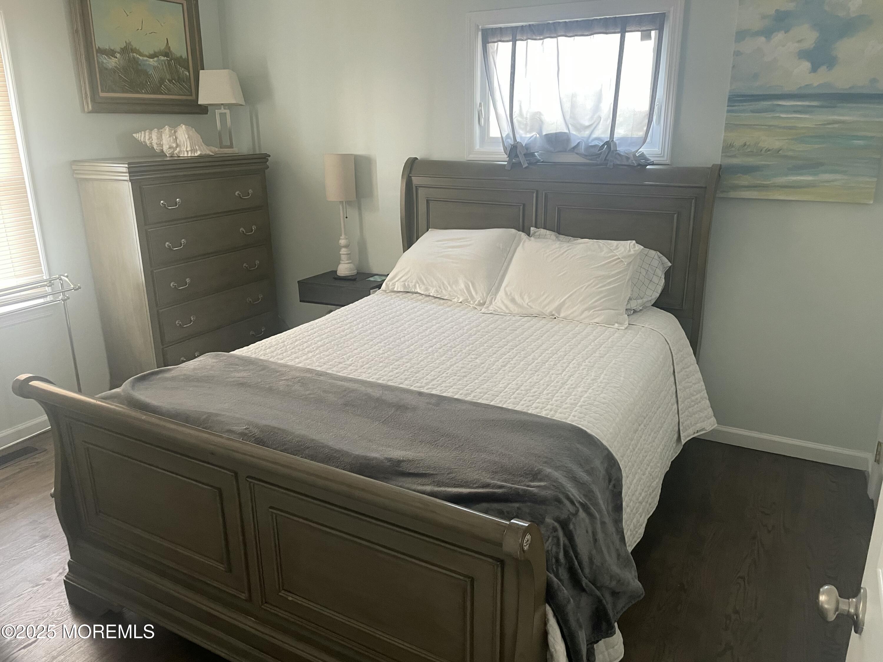 1510 R Bay Boulevard Seaside Heights, NJ 08751 - Photo 12 of 34 a bedroom with a bed and a window