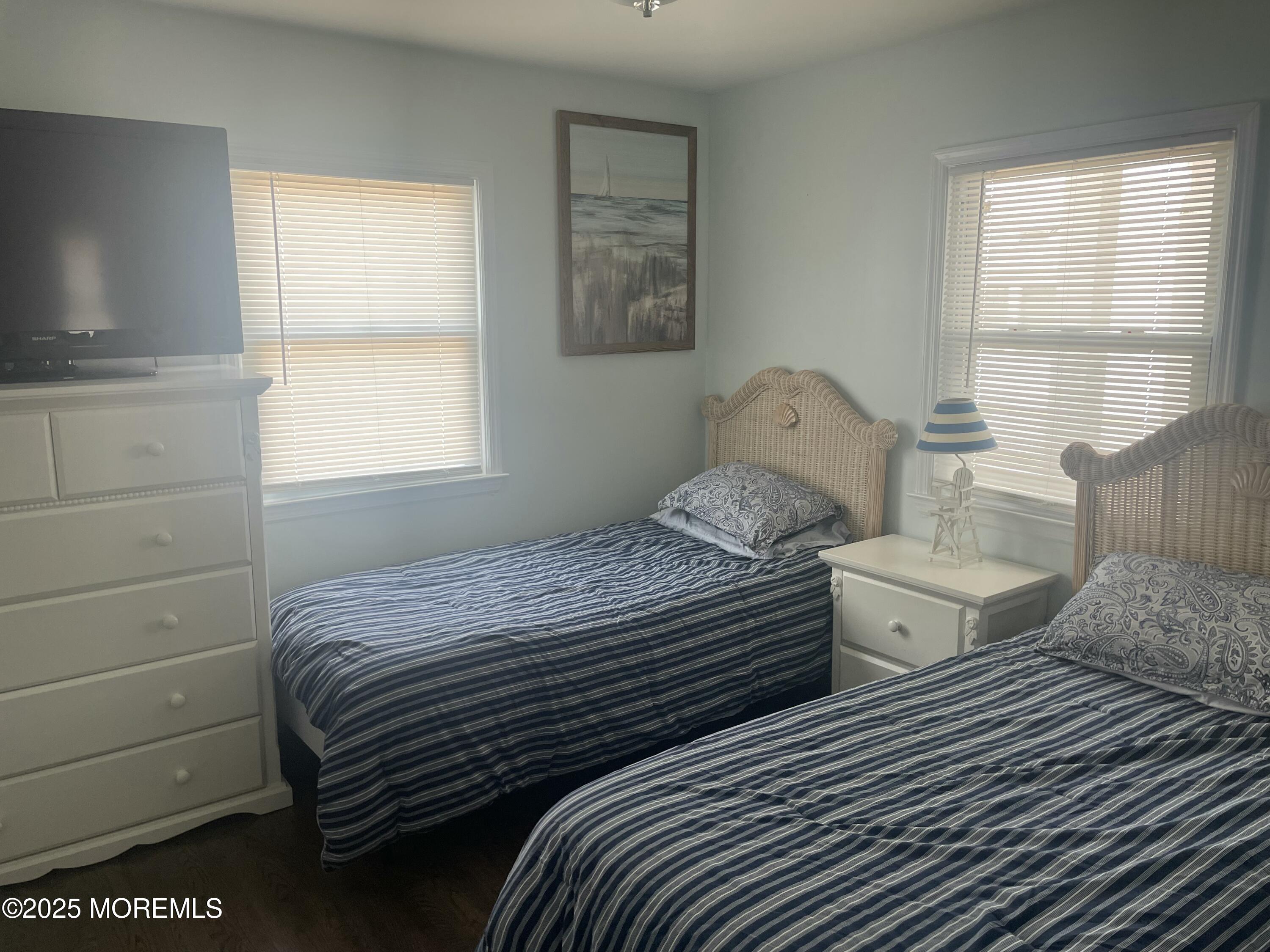 1510 R Bay Boulevard Seaside Heights, NJ 08751 - Photo 13 of 34 a bedroom with two beds and a window