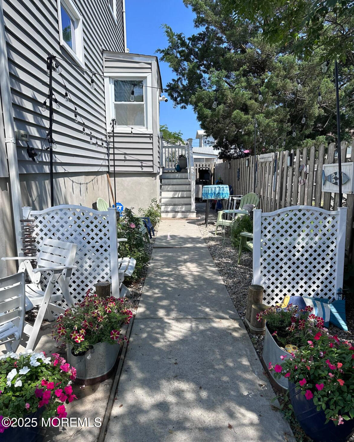 1510 R Bay Boulevard Seaside Heights, NJ 08751 - Photo 2 of 34 a wooden fence with some plants and trees