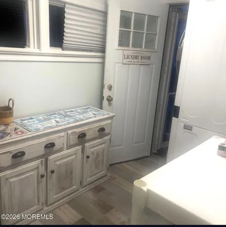 a bathroom with a toilet a sink and a window