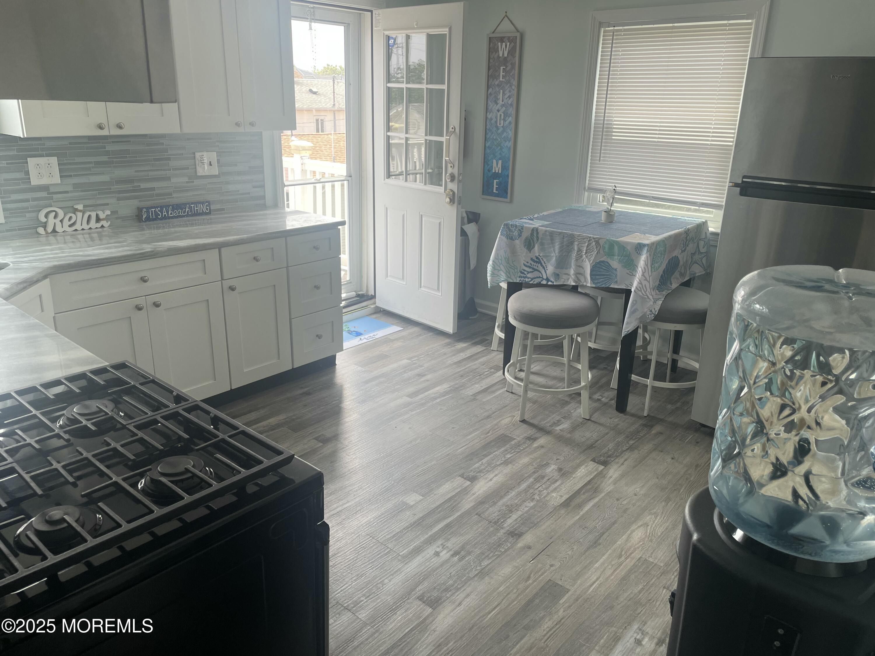 1510 R Bay Boulevard Seaside Heights, NJ 08751 - Photo 25 of 34 a kitchen with furniture wooden floor and a window