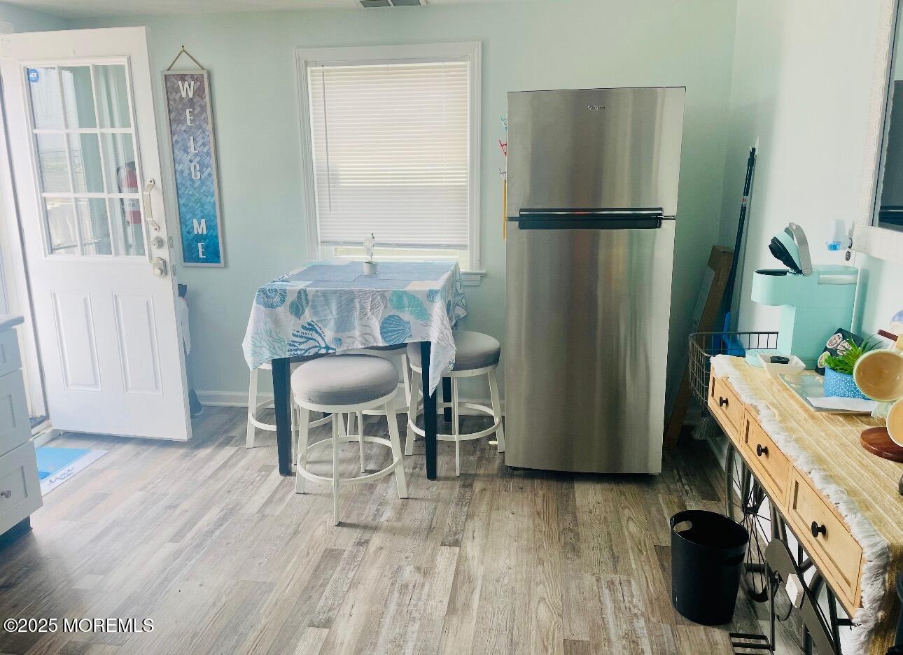 1510 R Bay Boulevard Seaside Heights, NJ 08751 - Photo 27 of 34 a kitchen with a refrigerator and wooden floor