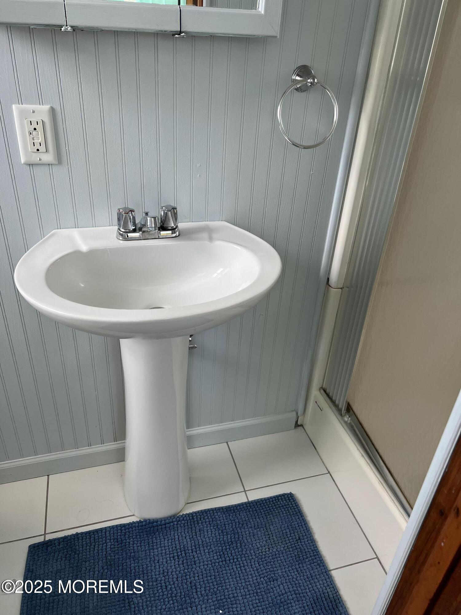 1510 R Bay Boulevard Seaside Heights, NJ 08751 - Photo 31 of 34 a bathroom with a sink and a mirror