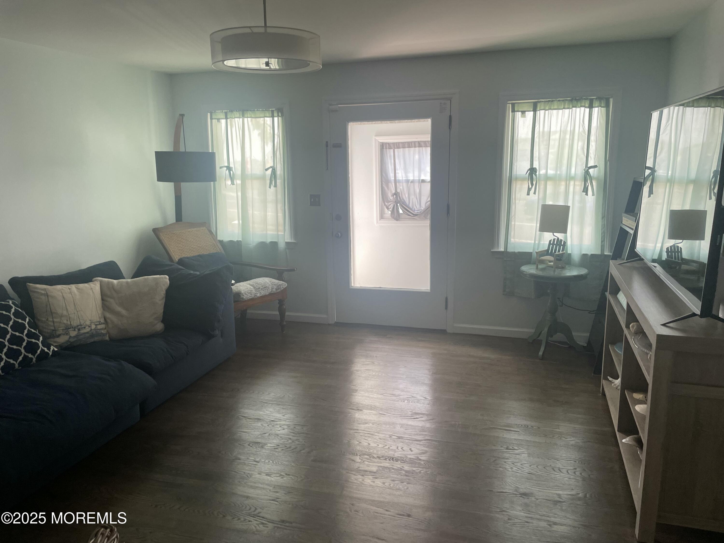 1510 R Bay Boulevard Seaside Heights, NJ 08751 - Photo 4 of 34 a living room with furniture and a flat screen tv