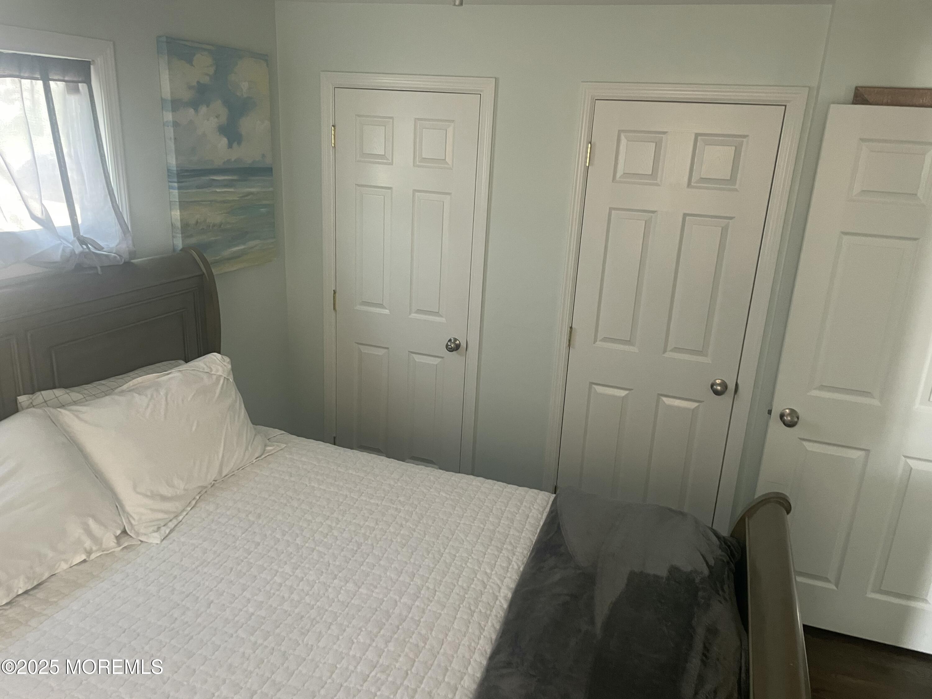 1510 R Bay Boulevard Seaside Heights, NJ 08751 - Photo 9 of 34 a bedroom with a bed and a window