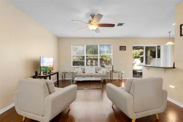 a living room with furniture and a large window