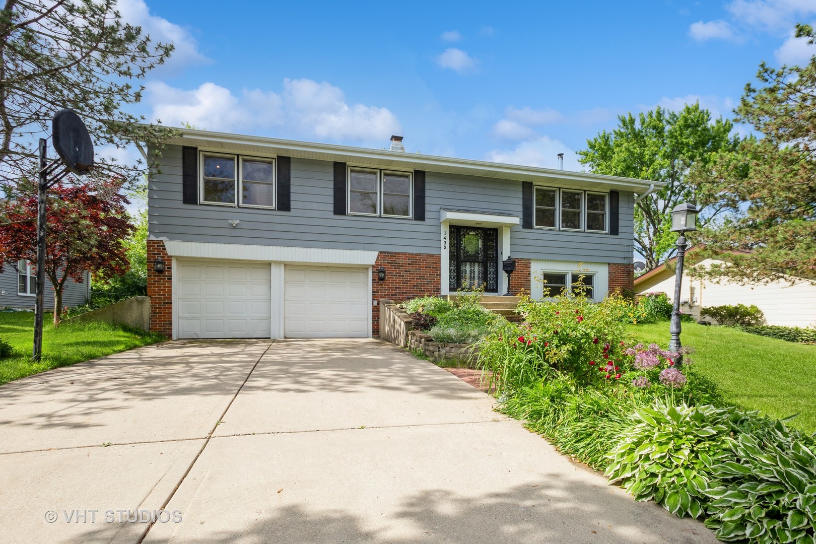a front view of a house with garden