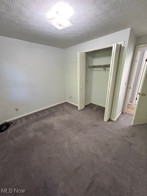 17510 Munn Road Chagrin Falls, OH 44023 - Photo 20 of 35 Unfurnished bedroom featuring carpet floors, a closet, a textured ceiling, and baseboards