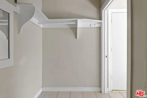 a room with granite countertop cabinets and a sink
