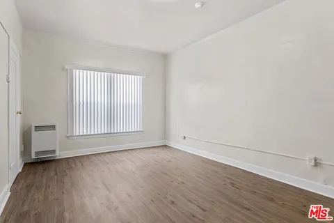 a bathroom with a sink mirror and toilet