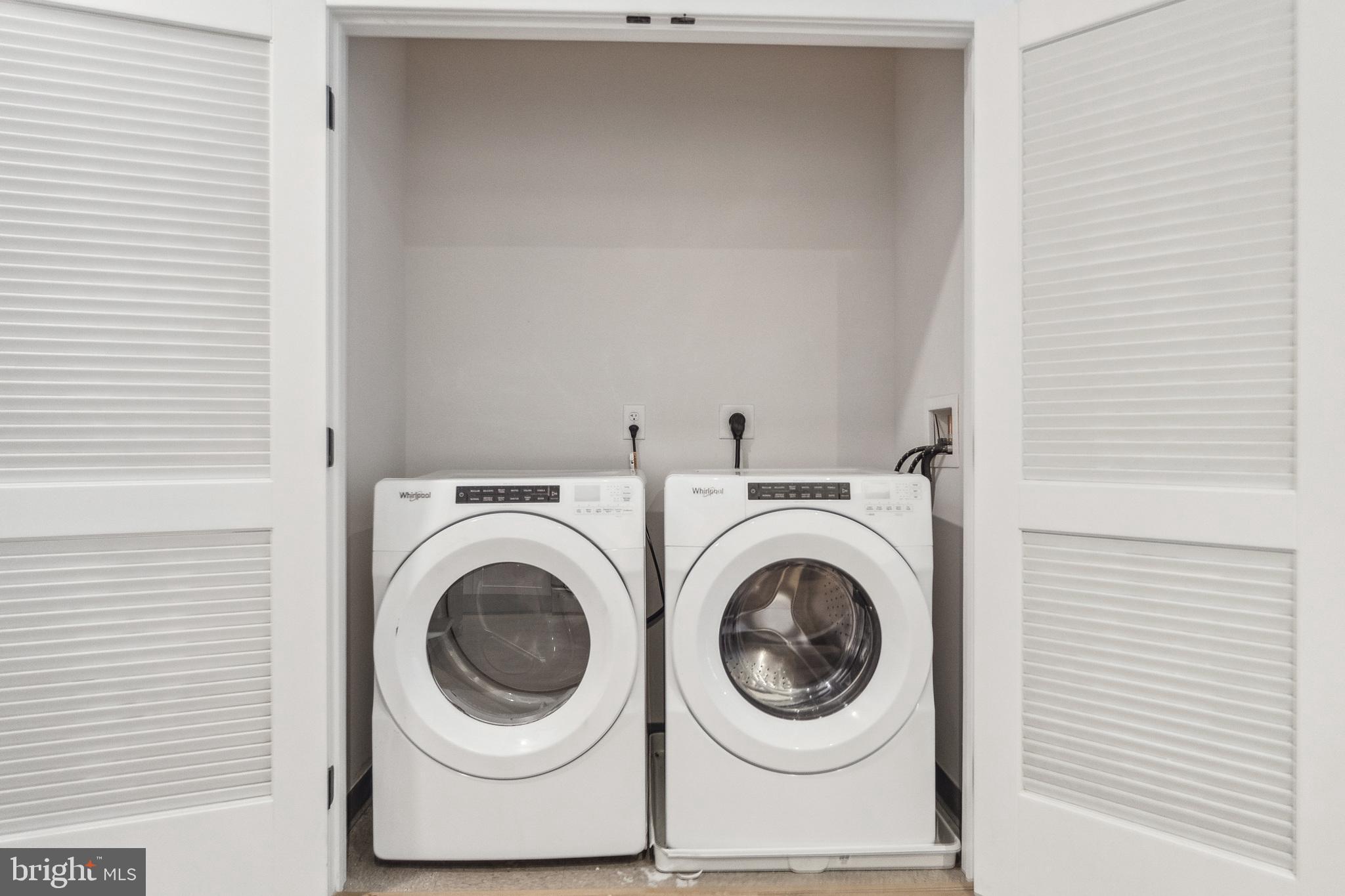 1339 E Street Southeast, Unit 309 Washington, DC 20003 - Photo 20 of 35 a utility room with dryer and washer