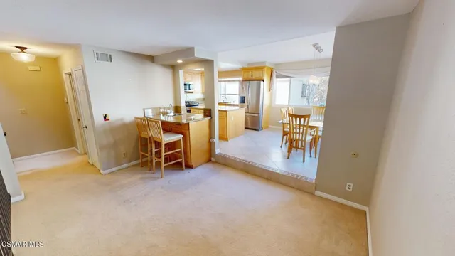a view of a livingroom with furniture and a gate