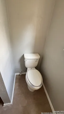 workspace with granite countertop sink and washing machine