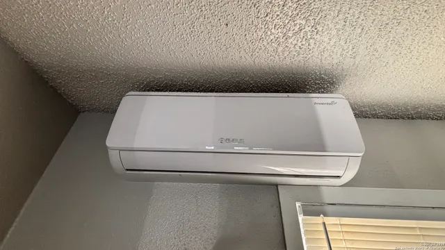 a kitchen with stainless steel appliances a refrigerator and a stove top oven