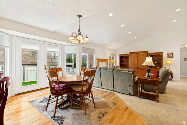 298 North Canyon Road Bountiful, UT 84010 - Photo 16 of 57 Open-concept dining and living areas featuring a vaulted ceiling with recessed lighting