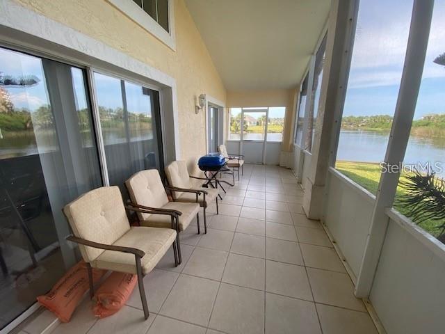 30 San Rafael Court Palm Coast, FL 32137 - Photo 11 of 32 a living room with furniture and a floor to ceiling window