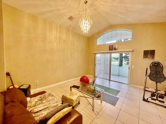 30 San Rafael Court Palm Coast, FL 32137 - Photo 21 of 32 a bedroom with a bed and gym equipment