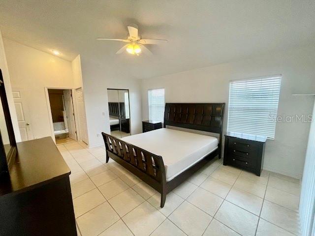 30 San Rafael Court Palm Coast, FL 32137 - Photo 30 of 32 a bedroom with a bed and a flat screen tv