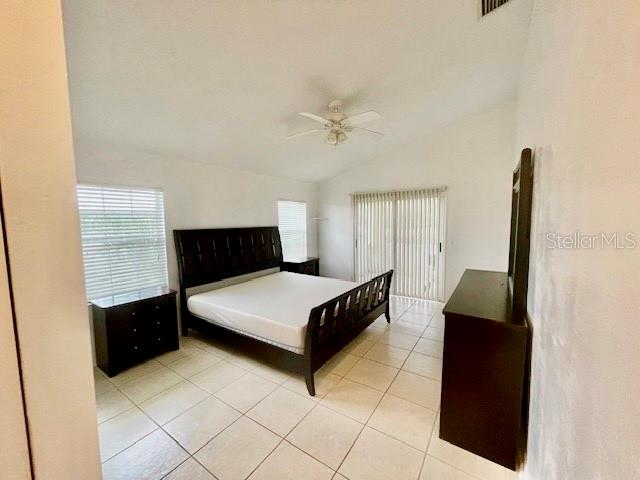30 San Rafael Court Palm Coast, FL 32137 - Photo 31 of 32 a living room with a bed furniture and a window