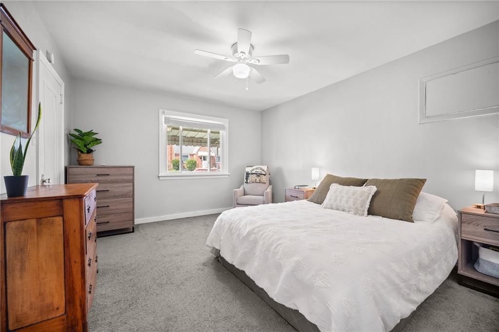 416 Phillips Avenue McKees Rocks, PA 15136 - Photo 23 of 46 a bedroom with a large bed and a window