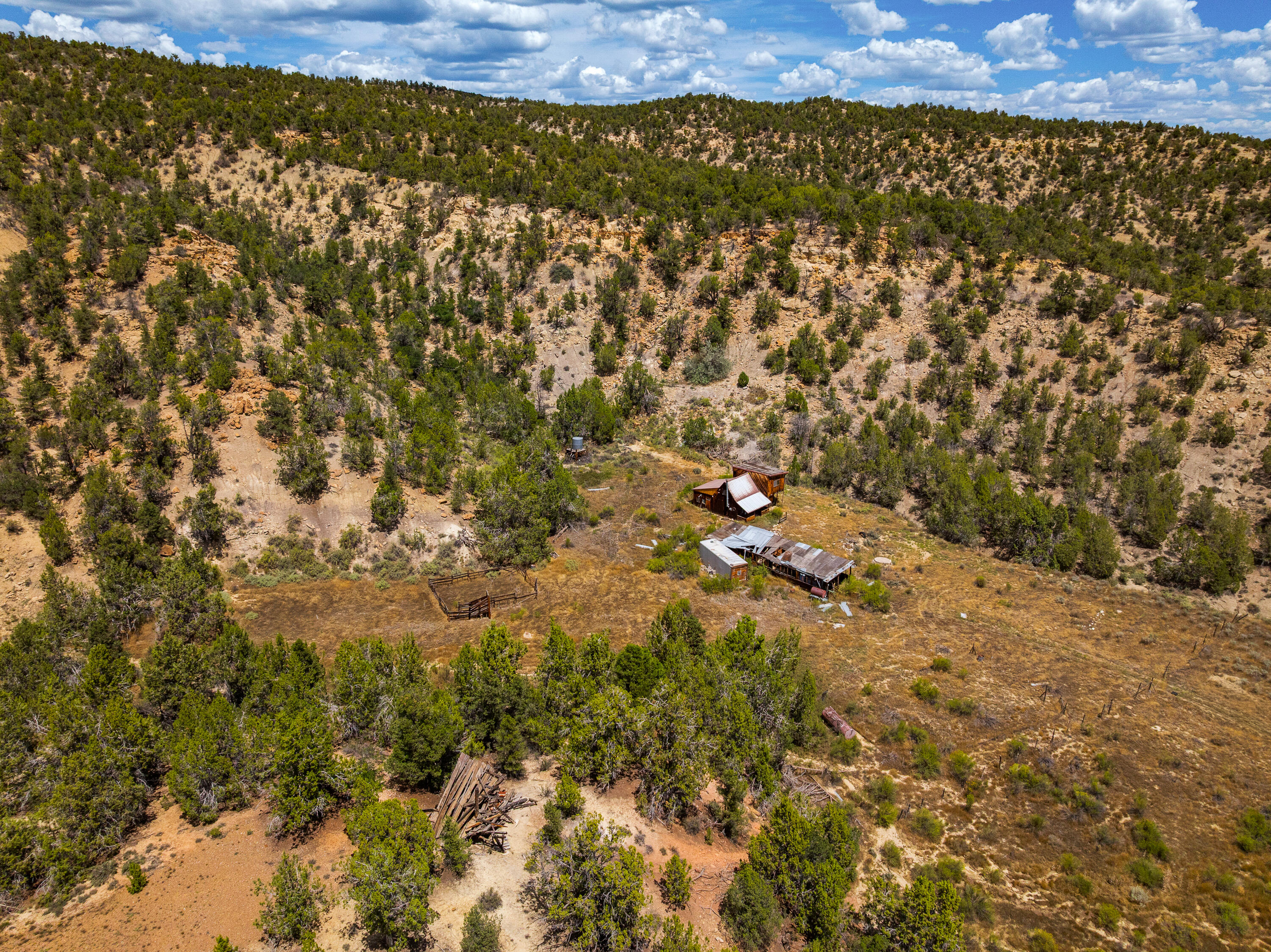 Rusty Nail Ranch Mount Carmel, UT 84755 - Photo 18 of 25 Aerial over the headquarters. Buildings sit in the sheltered draw with slope rising on both sides. All structures closed to entry