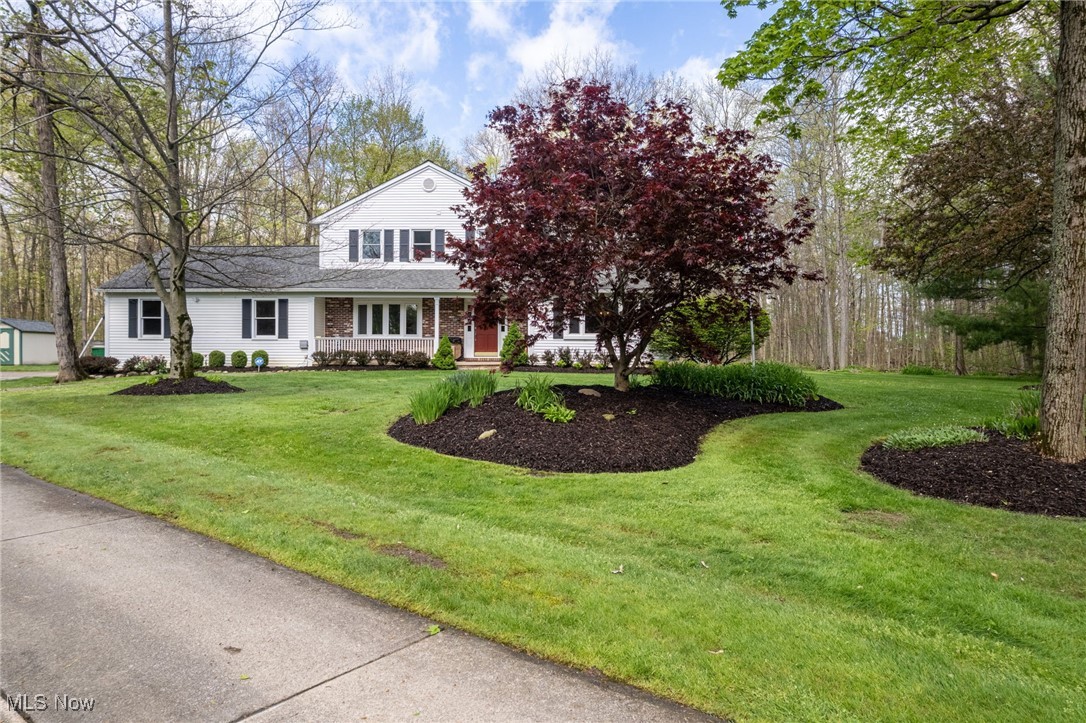 14566 West Ridge Road Novelty, OH 44072 - Photo 2 of 49 View of front of house with a shingled roof and a front lawn