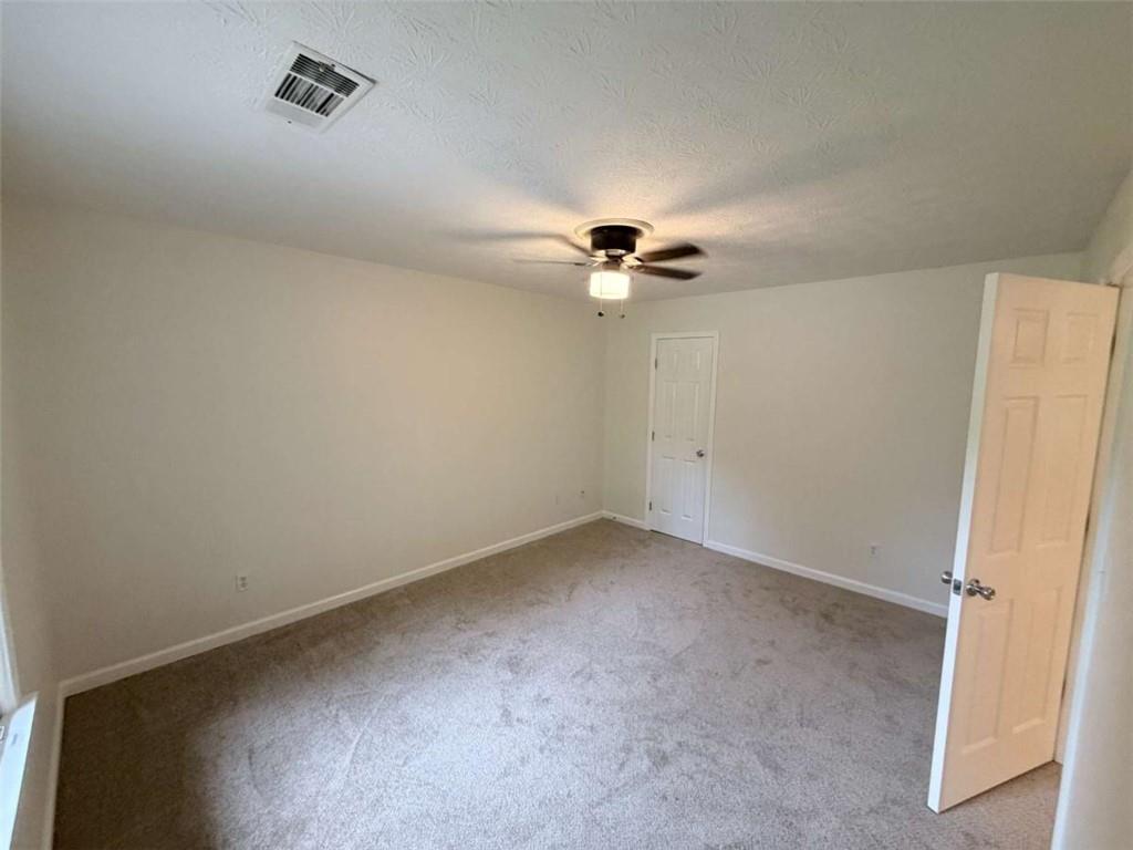 185 Roberts Road Covington, GA 30016 - Photo 10 of 25 wooden floor in an empty room