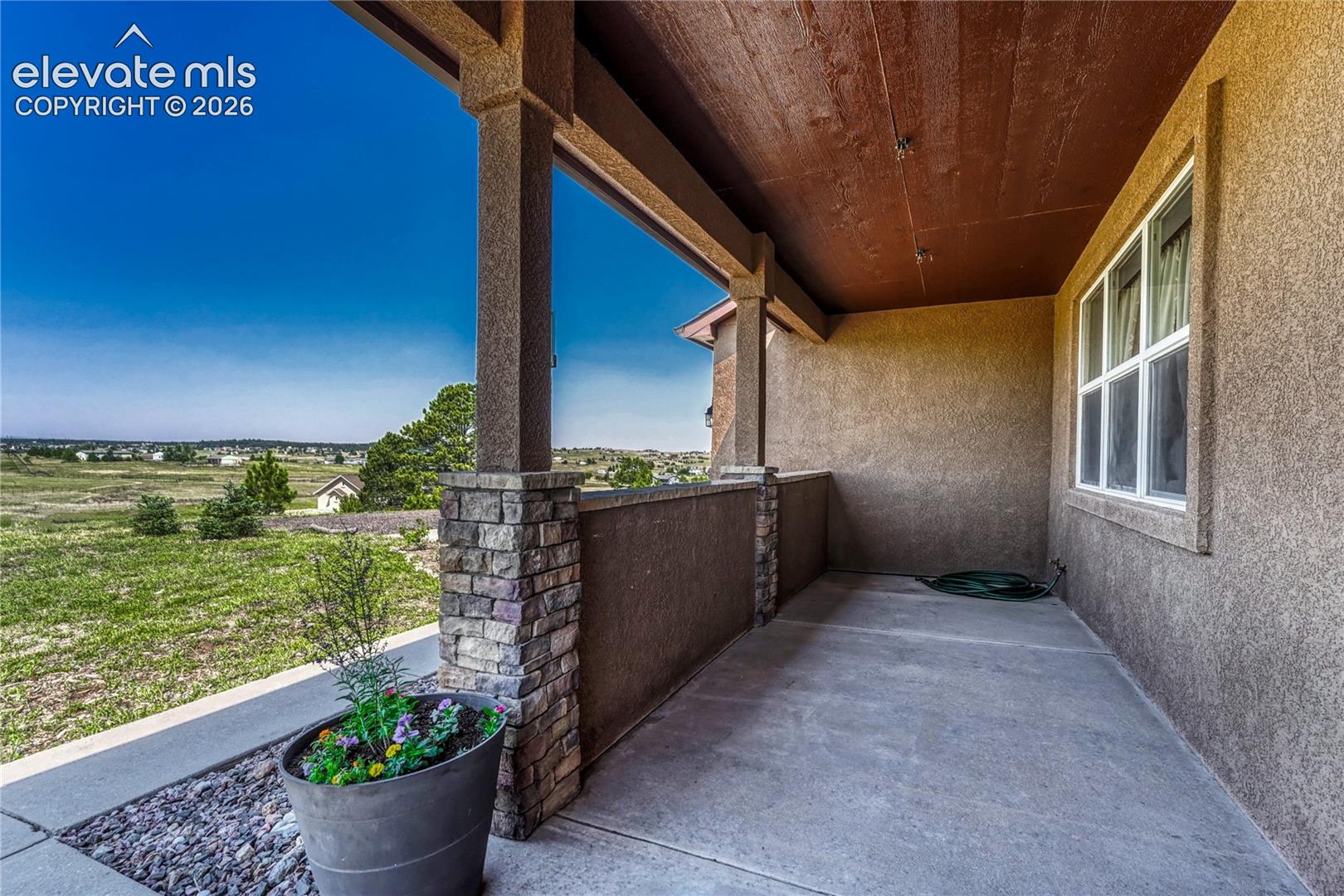 13695 Woodlake Road Elbert, CO 80106 - Photo 4 of 39 Enter from the covered front porch...