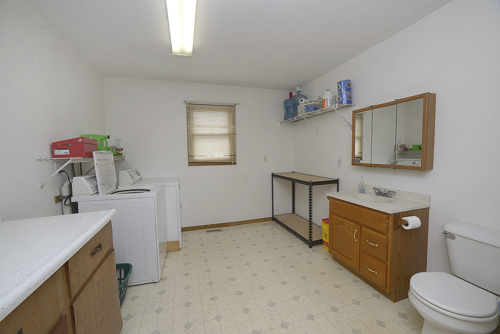 2098 North 15th Road Streator, IL 61364 - Photo 14 of 23 a kitchen with a stove a sink and a refrigerator