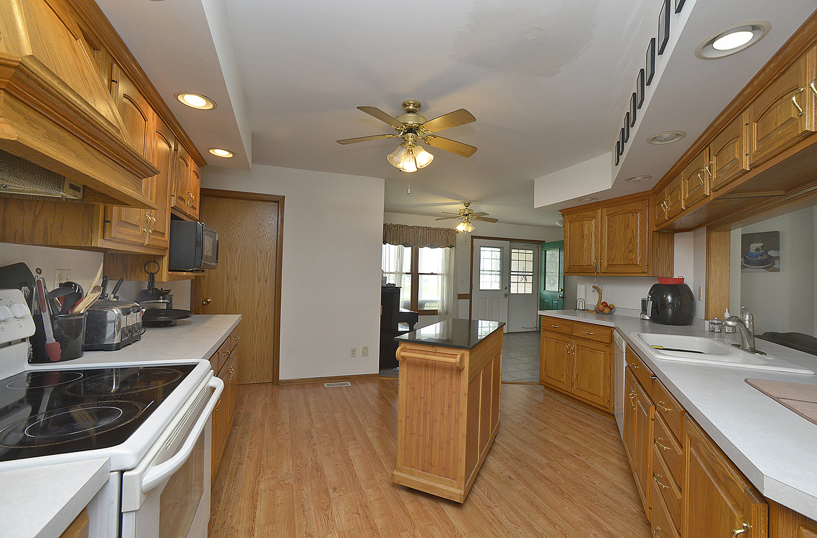 2098 North 15th Road Streator, IL 61364 - Photo 5 of 23 a kitchen that has a sink and chairs