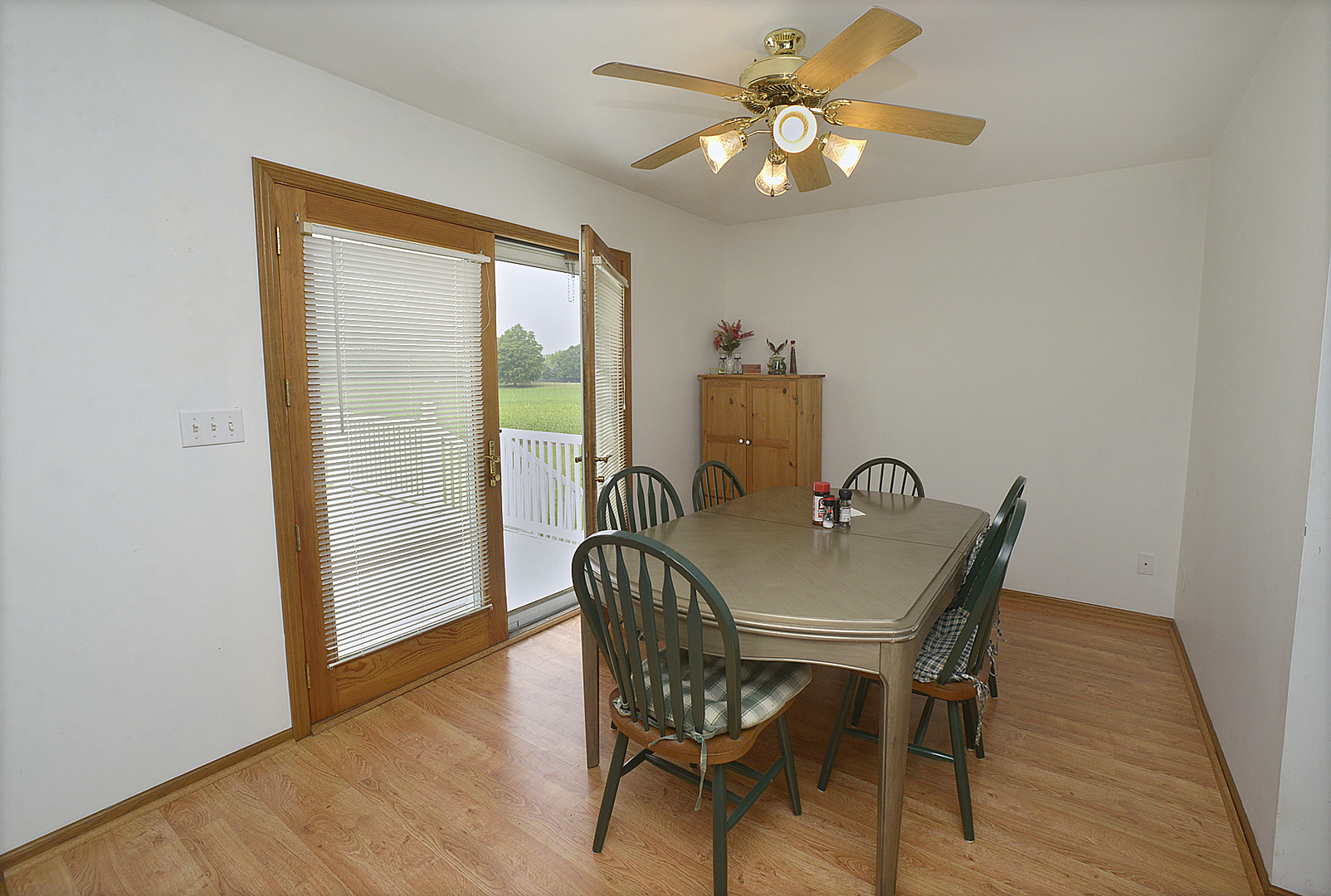 2098 North 15th Road Streator, IL 61364 - Photo 6 of 23 a view of a dining room with furniture window and wooden floor