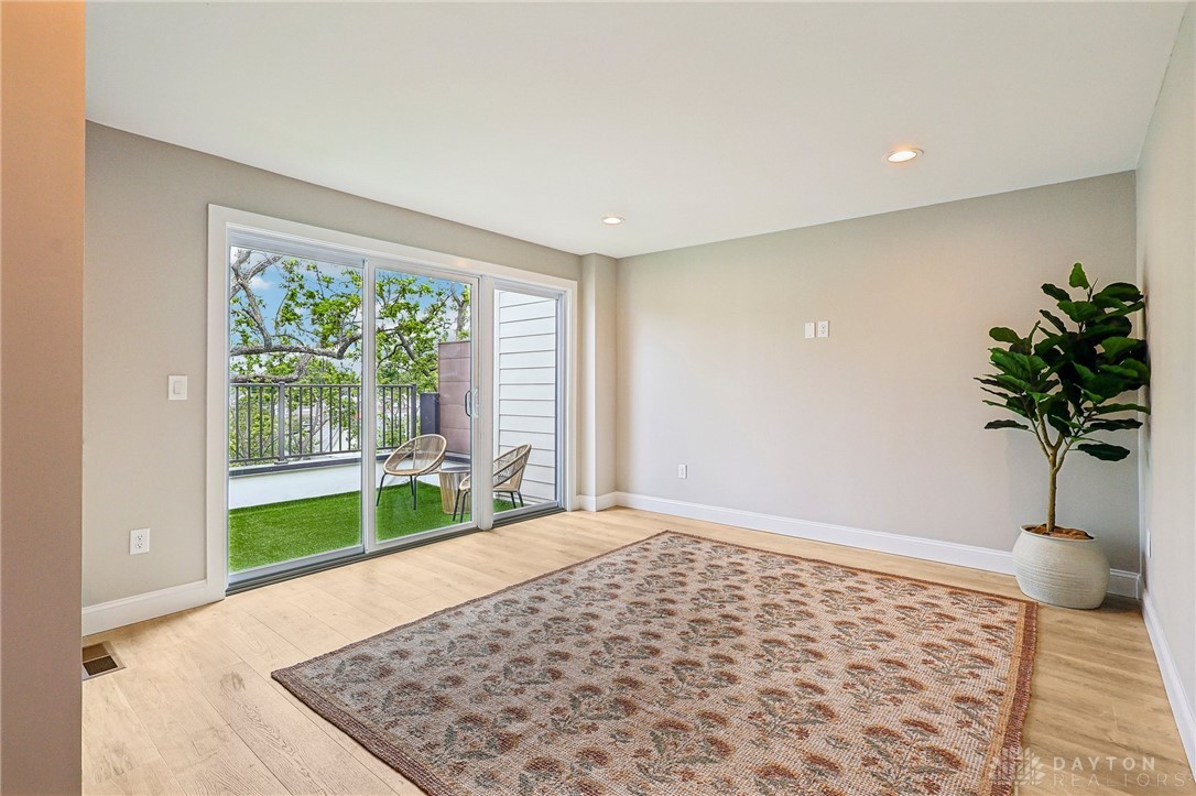 3906 Edwards Road, Unit C Cincinnati, OH 45209 - Photo 36 of 46 This bright space features a private balcony, offering seamless indoor-outdoor living.