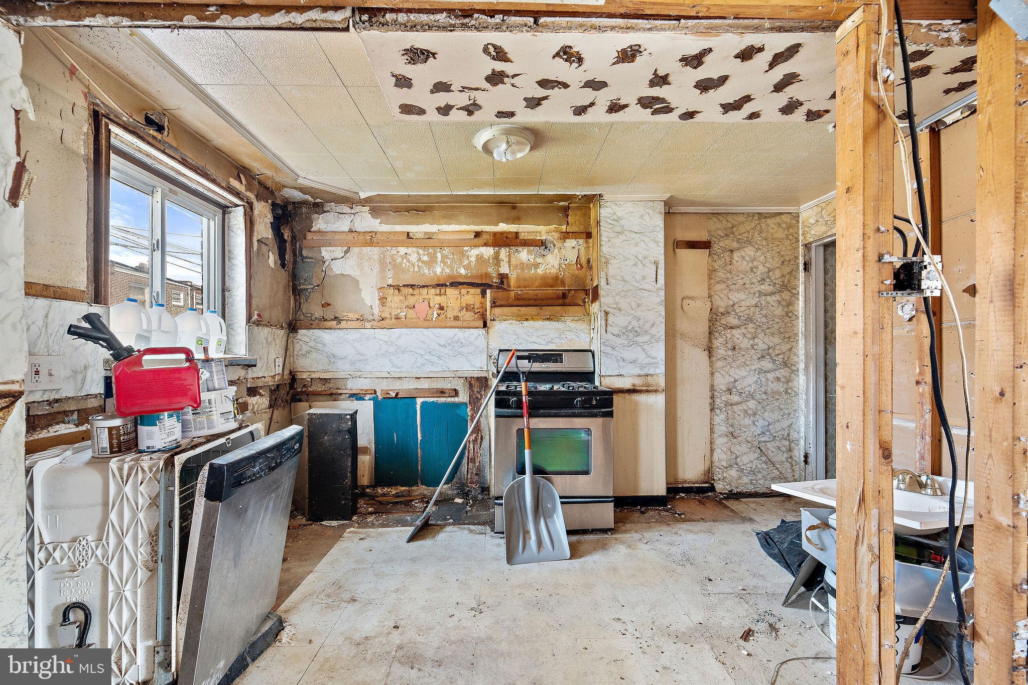 642 Randolph Street Camden, NJ 08105 - Photo 11 of 24 a kitchen with a sink appliances and cabinets