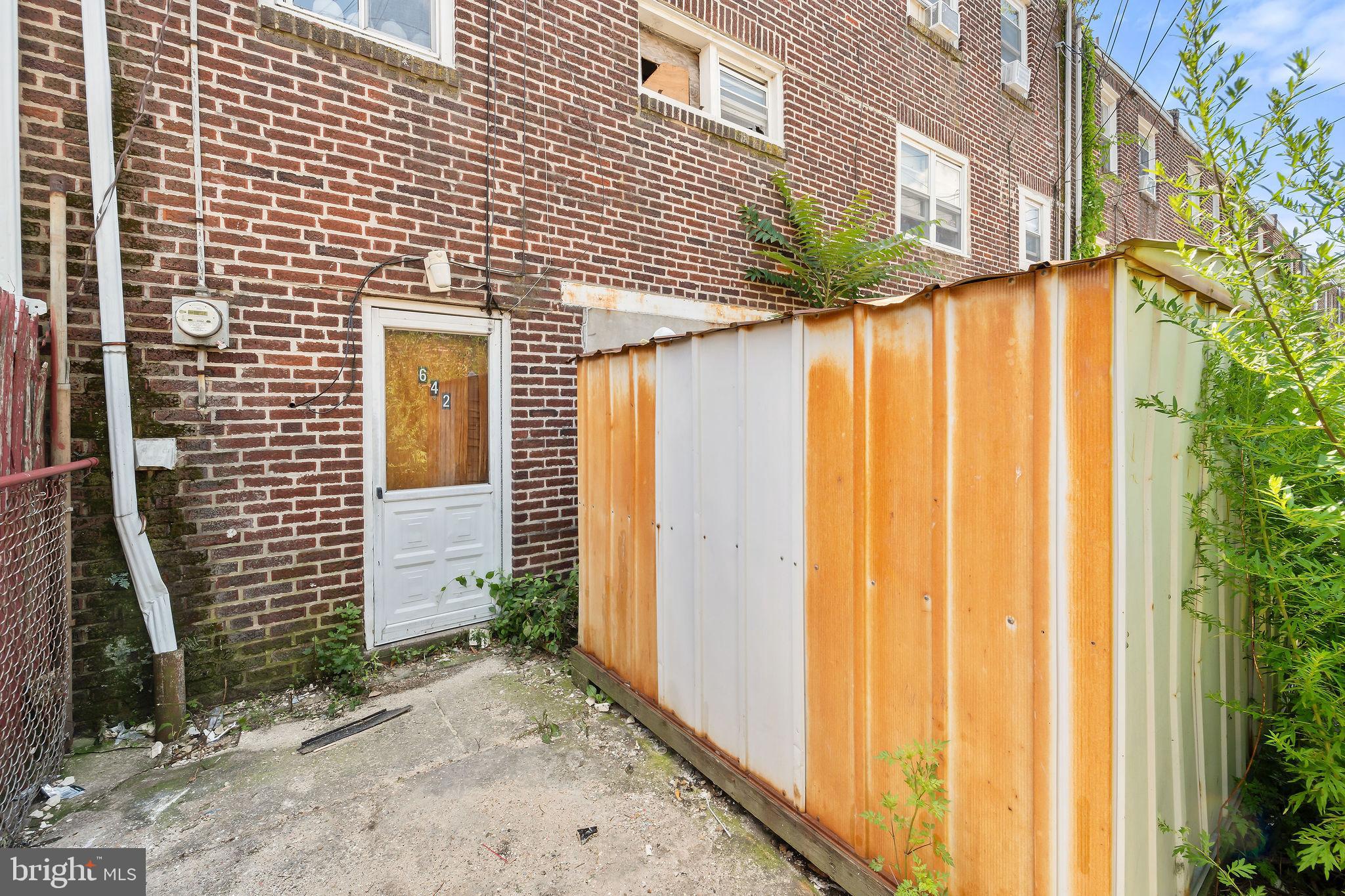642 Randolph Street Camden, NJ 08105 - Photo 24 of 24 a view of a house with a backyard
