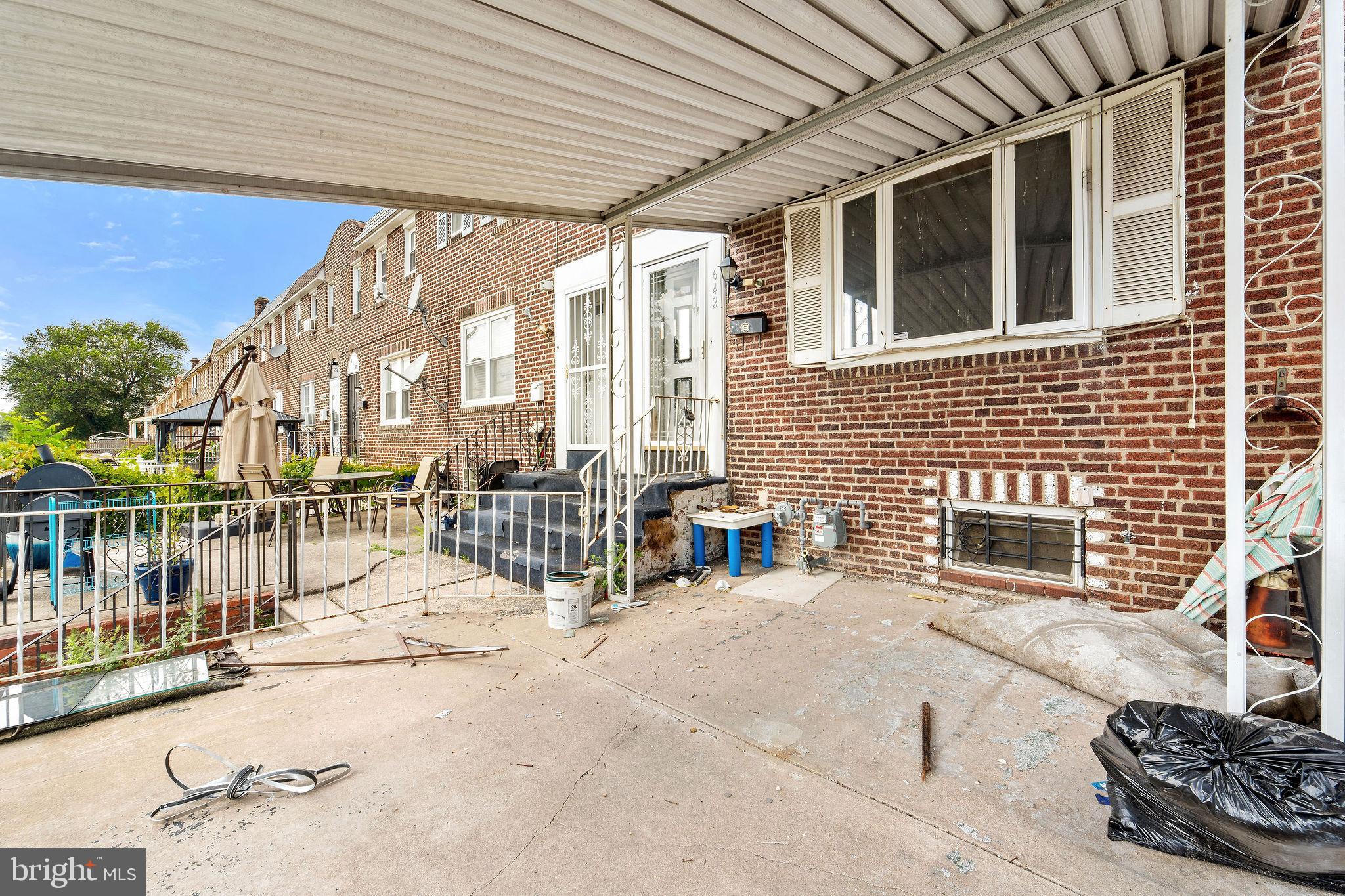 642 Randolph Street Camden, NJ 08105 - Photo 4 of 24 a view of a patio with a table and chairs