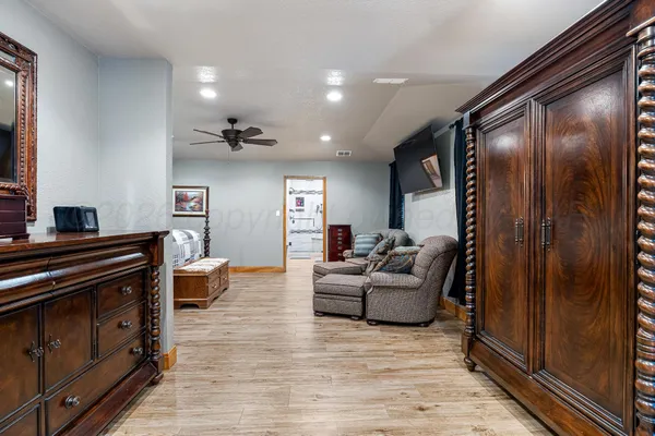 a living room with furniture and a mirror