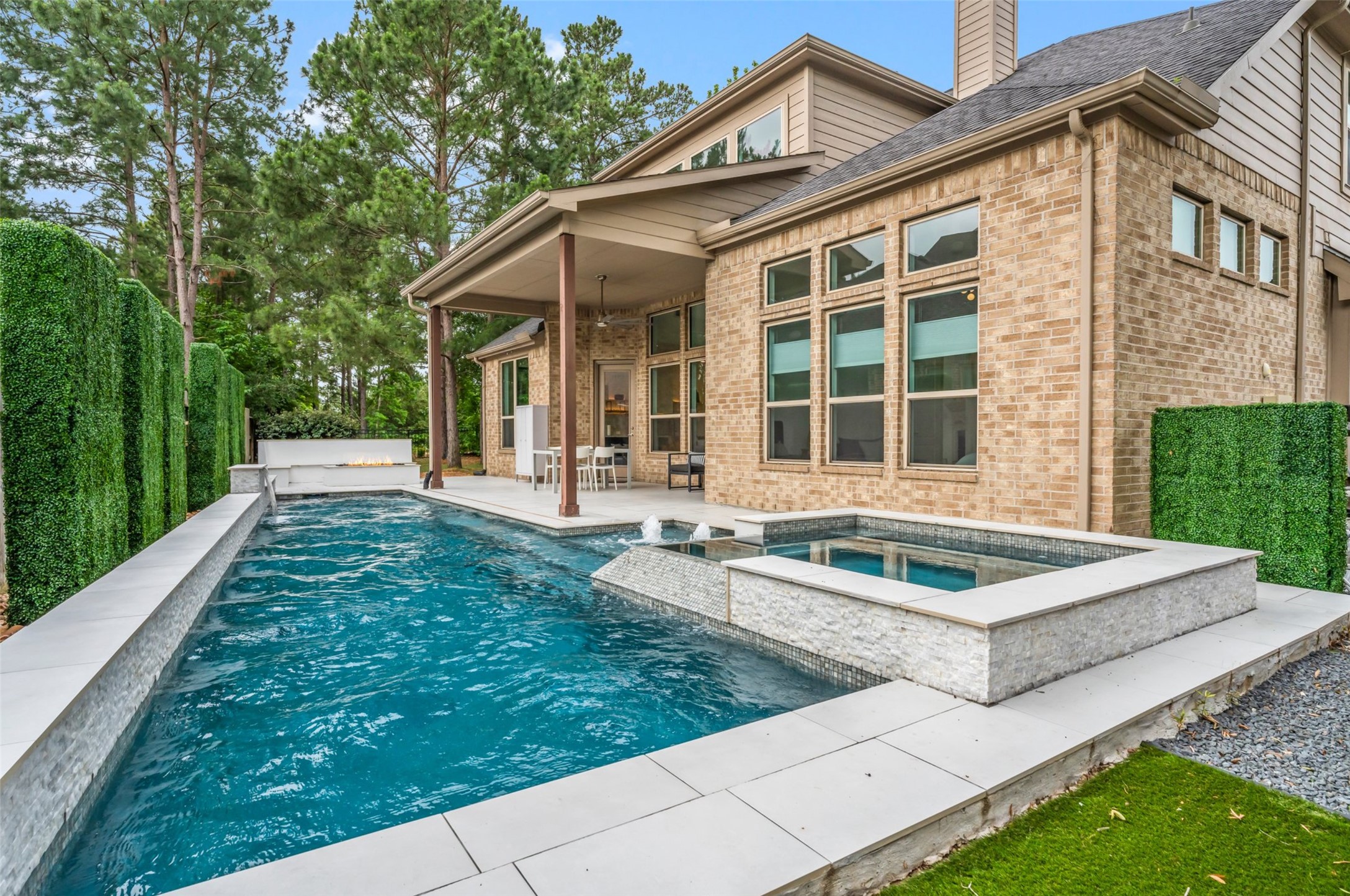 1053 Bat Hawk Court Conroe, TX 77385 - Photo 46 of 50 a front view of house with yard and trees in the background