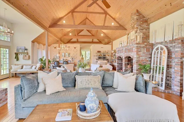 a spacious bathroom with a tub sink and mirror