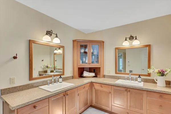 a view of a patio with table and chairs under an umbrella