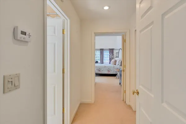 a pathway of a house with a yard