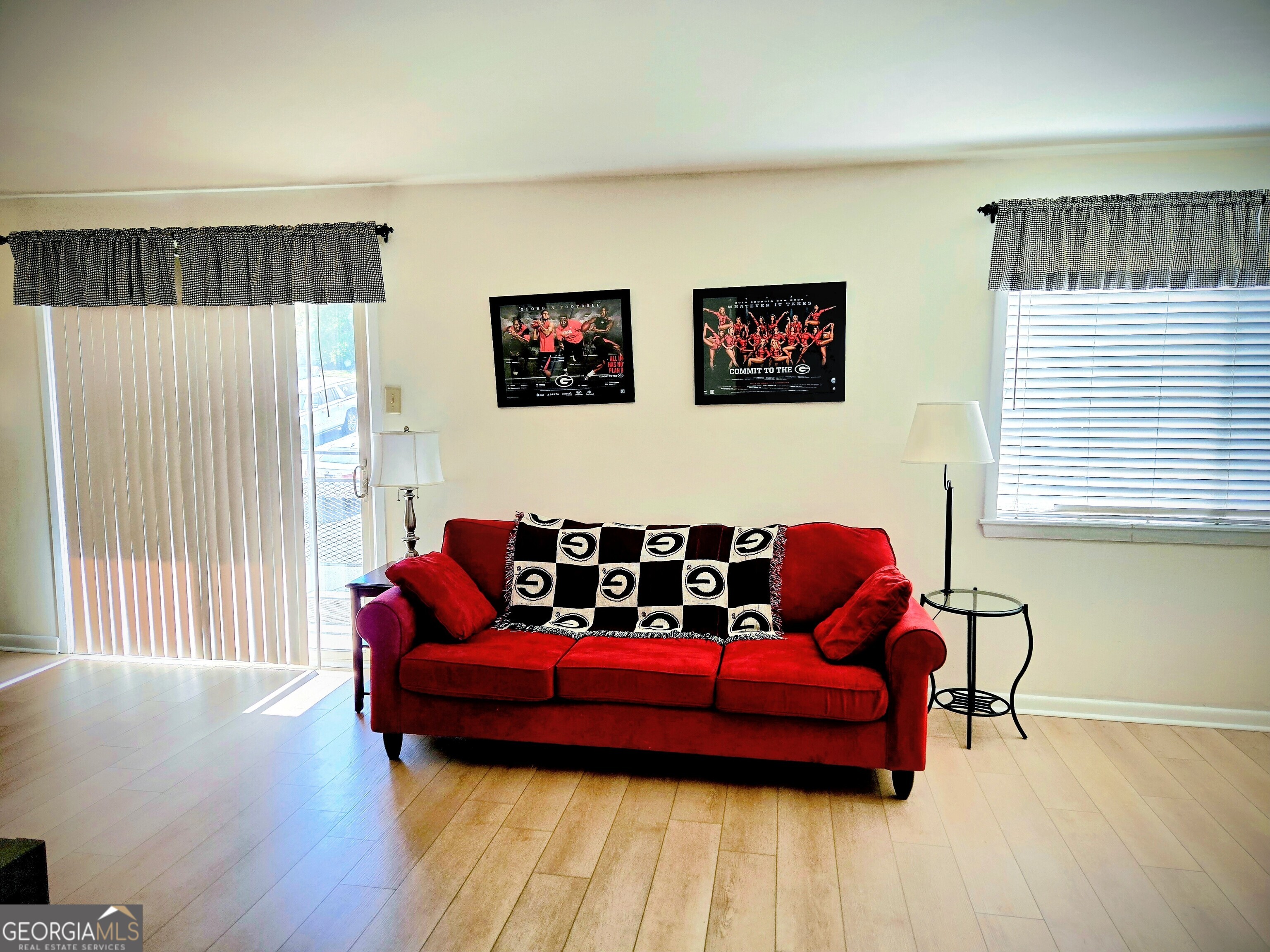 250 Little Street, Unit C210 Athens, GA 30601 - Photo 1 of 1 a couch sitting in a room next to a window