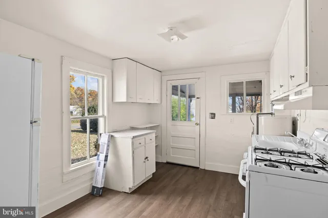 a view of a livingroom with wooden floor
